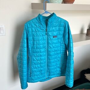 Woman’s blue Patagonia lightweight puffy jacket, size large great condition.